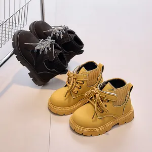 Detail of kids leather boots showing nubuck texture, knitted collar, and rugged rubber sole