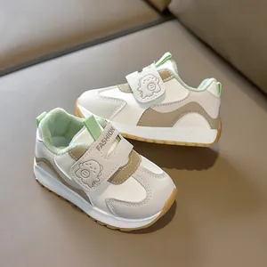 Detail of warm plush lining and green fleece interior of toddler sneakers with dinosaur patch
