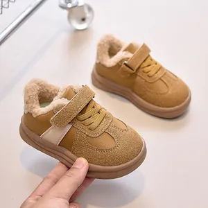 Detailed view of warm brown faux suede kids' sneakers with soft faux shearling lining