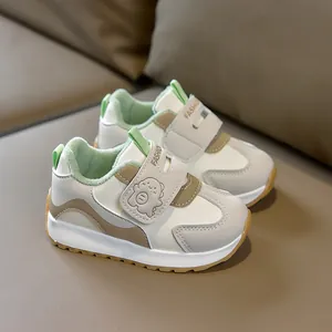 Detail of warm plush lining and velcro strap with cartoon monster on baby walker shoes