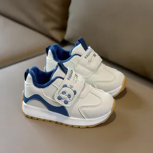 Detail view of winter baby sneakers with warm fleece lining and a cute panda velcro strap