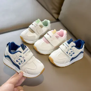 Detail view of anti-slip children sneakers with velcro straps and soft fleece lining