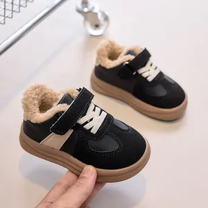 Detail view of winter kids' sneakers featuring warm faux shearling lining and hook-and-loop straps