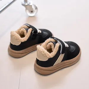 Detailed close-up of warm faux lamb wool lining and velcro strap on kids' winter sneakers