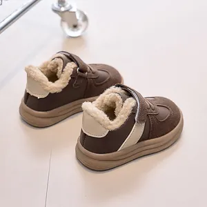 Detail view of children winter sneakers with warm faux fleece lining and velcro strap