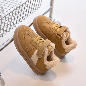 Close-up of children's winter shoes with warm faux shearling lining and hook-and-loop strap