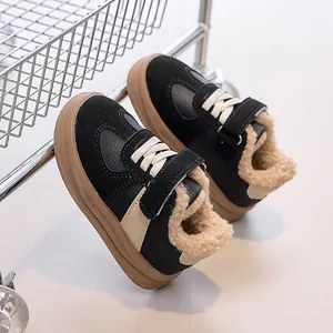 Close-up of winter kids sneakers featuring plush fleece lining and black suede material