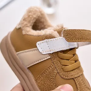 Detail of winter kids sneakers featuring warm fleece lining and adjustable velcro straps