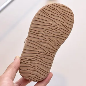 Detail of winter shoe sole featuring wavy anti-slip texture and size 23/165 marking