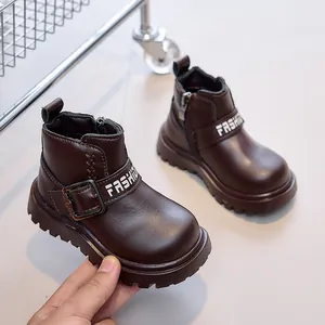 Detailed view of kids dark brown boots with side zipper and fashion buckle strap