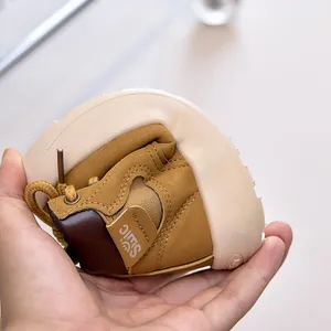Close-up showing the extreme flexibility and soft rubber sole of kids outdoor boots