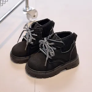 Classic black children's autumn ankle boots with knit cuffs and anti-slip thick soles