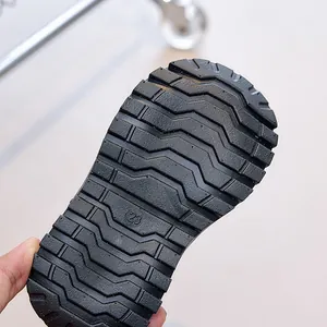 Detail of size 23 anti-slip rubber sole with deep wavy tread for kids' boots
