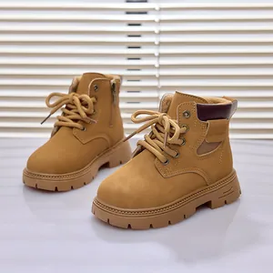 Detail view of ginger yellow kids martin boots with warm lining and side zipper