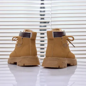 Rear view of khaki leather kids boots with thick non-slip rubber soles and warm lining