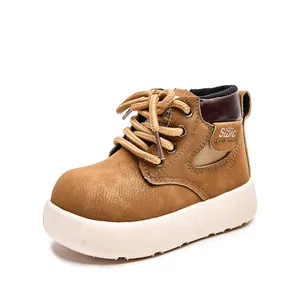 Classic camel children boots with thick rubber soles and brushed leather texture