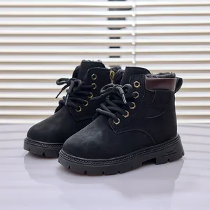 Detailed view of kids warm black winter boots with thick plush lining and side zipper