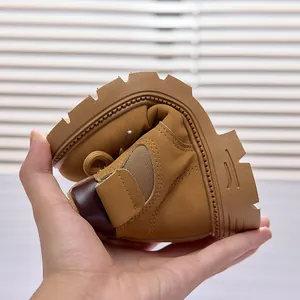 Detail showing the flexible anti-slip sole of kids brown leather boots for boys and girls