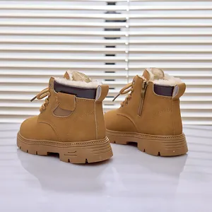 Detail showing plush faux fleece lining and side zipper of children's tan martin boots