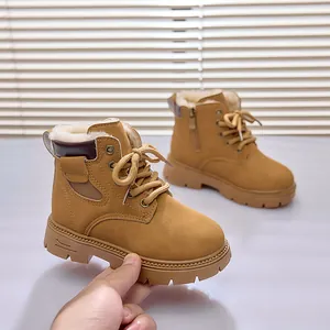 Close-up of children's warm yellow boots featuring thick faux shearling lining and non-slip sole