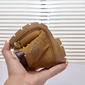 Close-up of flexible brown kids leather boot showing high durability and bendable soft sole