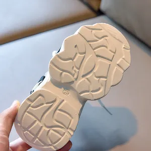 Detailed macro view of the non-slip thick rubber sole on breathable kids sneakers