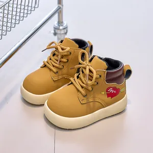 Kids mustard yellow ankle boots with red heart pattern and convenient side zipper
