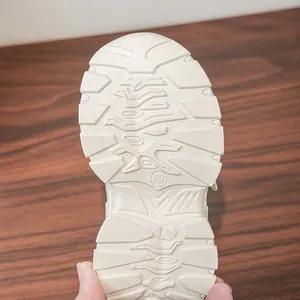 Macro detail of anti-slip rubber sole with size 23 marking for kids sneakers