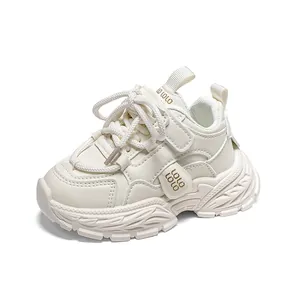 Minimalist white kids chunky sneakers with soft soles and velcro strap closure