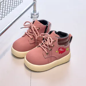 Pink children's Martin boots with heart embroidery and side zipper closure