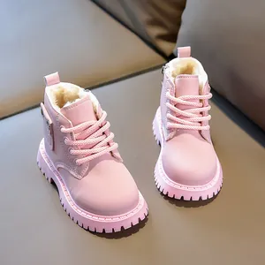 Detailed view of pink children's boots with thick faux fur lining and side pocket