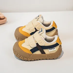 Detail view of baby walking shoes with dual velcro straps and cartoon panda design