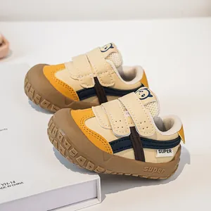 Detail of baby functional shoes with dual velcro straps and protective rubber toe cap