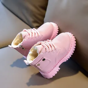 Detailed view of pink leather kids boot with warm plush lining and side zipper
