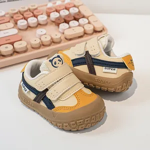 Detailed view of child sneakers featuring double velcro straps and a cute panda tongue