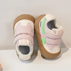 Detail of pink panda baby shoes with double hook-and-loop straps and a non-slip rubber sole