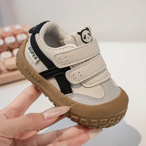 Close-up of baby sneakers with panda design and non-slip rubber sole for infant safety