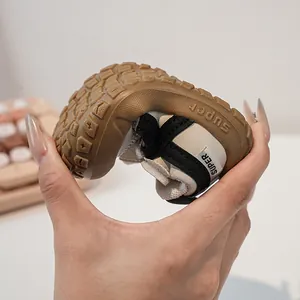 Close-up of flexible rubber sole on children sneakers showing superior softness