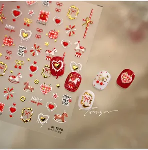 Detail of M1340 nail art stickers with red bows, gold carousels, and fireworks