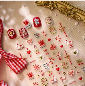 Detail of New Year nail stickers with red hearts, rocking horse and bow tie designs