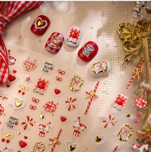 Detailed view of New Year nail art stickers with red bow, heart, and carousel patterns