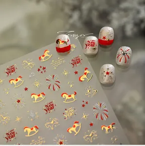 Macro detail of New Year nail stickers with gold horses, fireworks, and stars