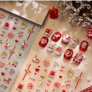 Detail of 3D embossed New Year nail stickers featuring red rocking horse and hearts