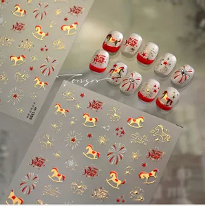 Detail of New Year nail art stickers with gold pony, fireworks, and stars patterns