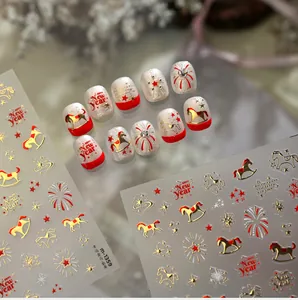 Detail of New Year nail stickers featuring gold horses, red stars and fireworks patterns