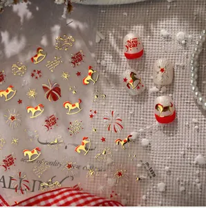 Close-up of M-1359 New Year nail stickers with gold horses, stars and festive fireworks