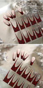 Detail of red and black plaid French nail art stickers with a winter holiday theme
