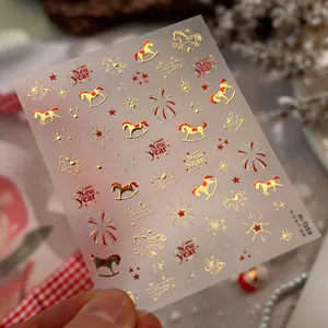 Close-up of M-1359 New Year nail stickers featuring golden rocking horses and stars