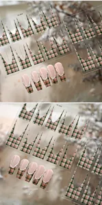 Detailed view of French green and red plaid nail stickers with application effects