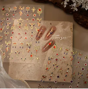 Detail of m-1324 nail stickers with golden phoenix patterns and faux gemstone accents